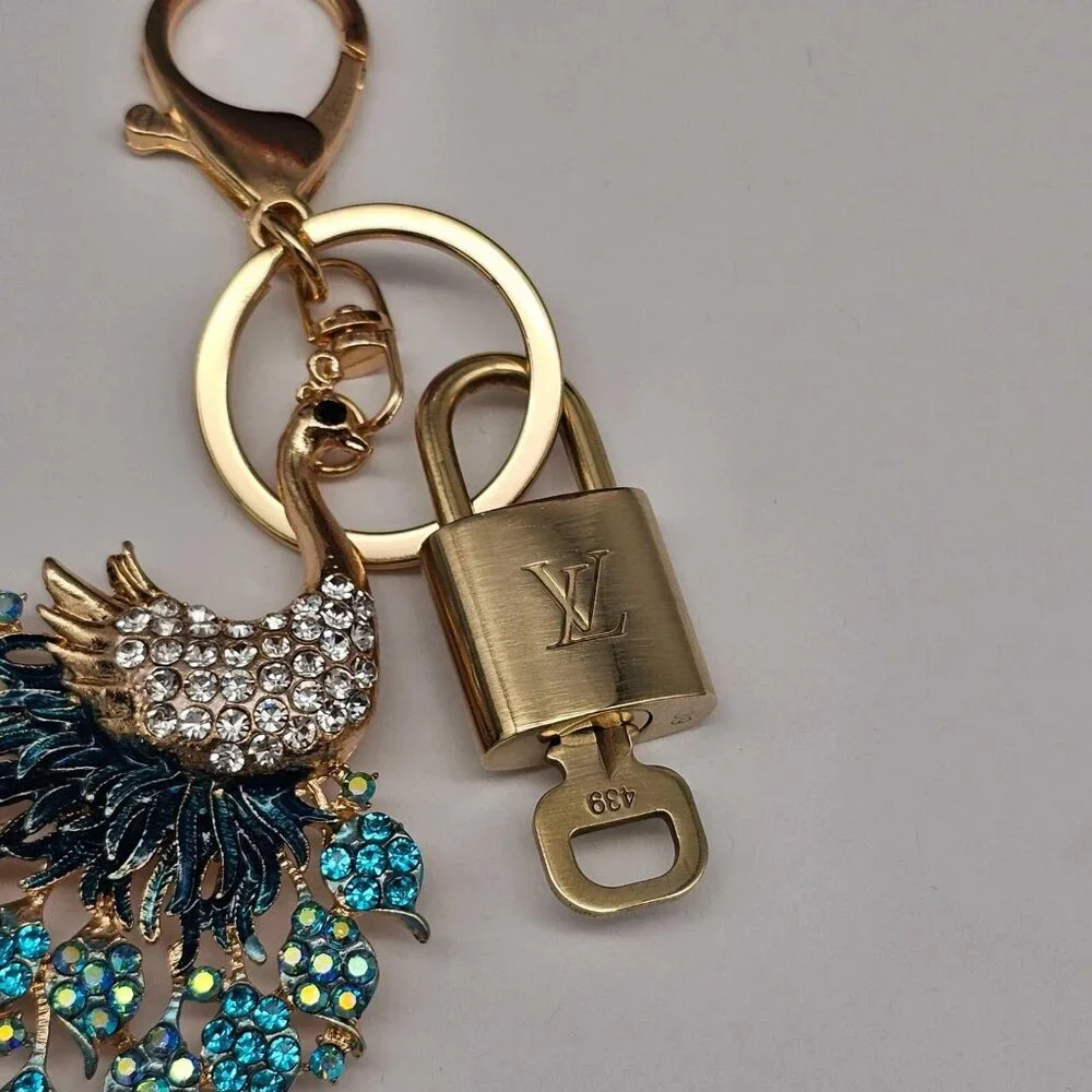 Authentic Louis Vuitton Lock & Key with unbranded Peacock Bagcharm, Keycharm